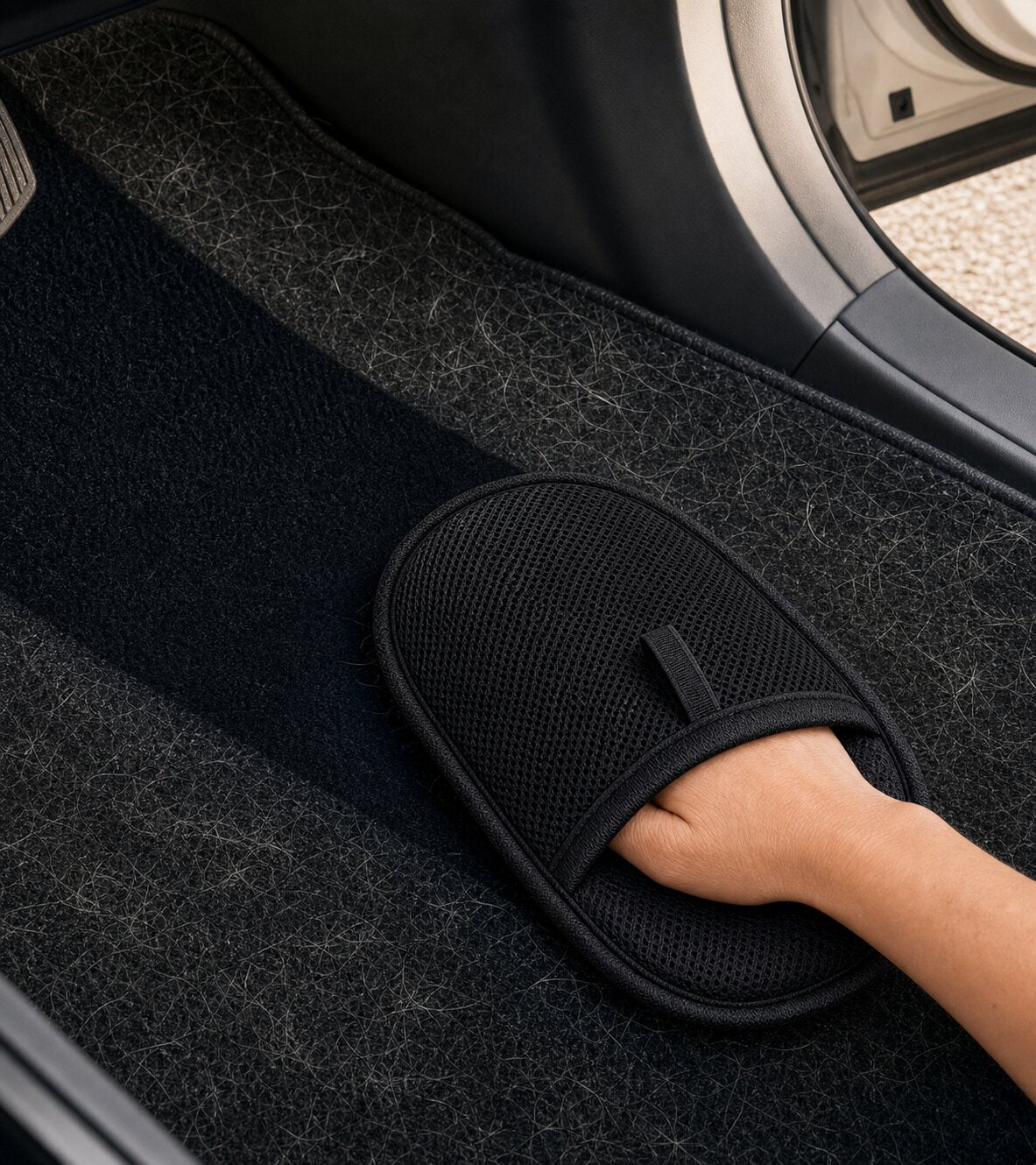 FurEraser cleaning hair from a car mat
